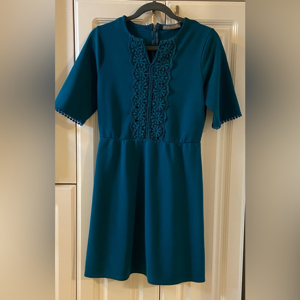 Medium dark aqua dress with embroidered neckline